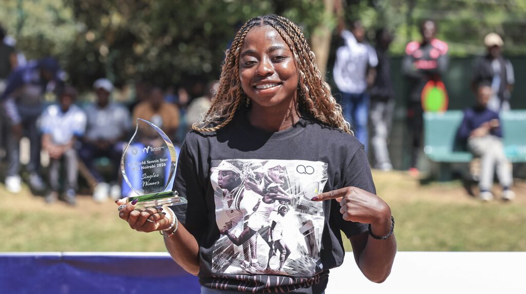 Angela Okutoyi, kenyan tennis player and Grand Slam, holding one of her ITF World tennis Trophy